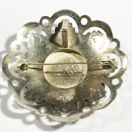 silver and gold brooch