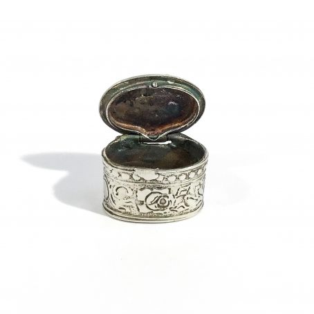 small solid silver pill box with floral decoration, hallmarked 