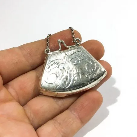 vintage silver handbag-shaped pad holder