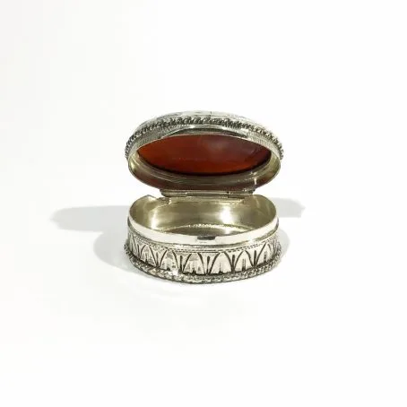 art deco silver pill box with open carnelian