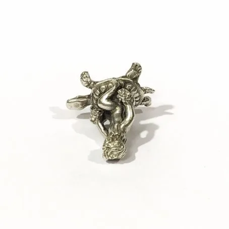 collector’s silver miniature putto on turtle