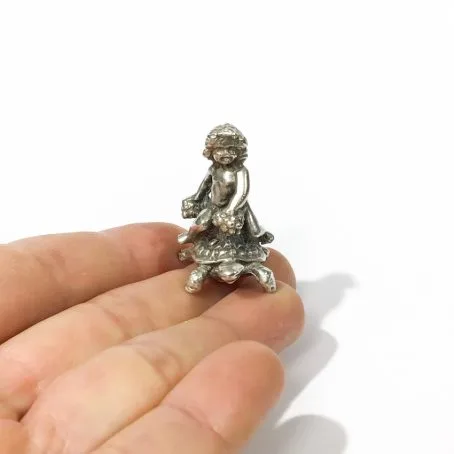 vintage silver miniature putto on turtle