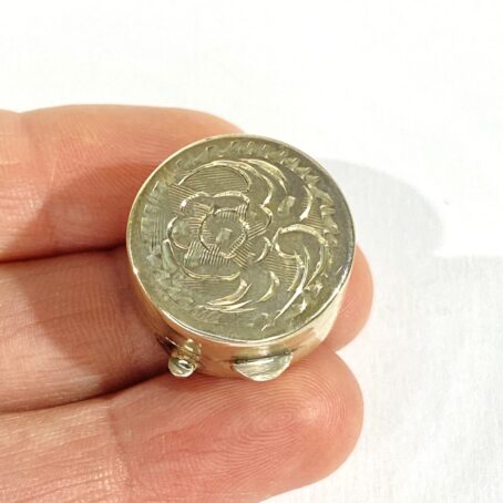 small pill holder with floral decorations